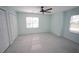 Bright bedroom with a ceiling fan, carpet and two windows with blinds and closet space at 113 Hawkscrest Ct, Apex, NC 27502