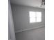 Neutral bedroom featuring a ceiling fan and large window, providing ample natural light at 113 Hawkscrest Ct, Apex, NC 27502