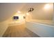 Bonus room with carpet, TV, ceiling fan and plenty of natural light and storage at 113 Hawkscrest Ct, Apex, NC 27502