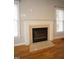 Cozy fireplace with a decorative mantel, perfect for relaxing evenings at 113 Hawkscrest Ct, Apex, NC 27502