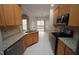 Well-appointed kitchen with stainless steel appliances, granite countertops, and tile flooring at 113 Hawkscrest Ct, Apex, NC 27502