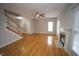 Inviting living room boasts hardwood floors, a fireplace, and plenty of natural light at 113 Hawkscrest Ct, Apex, NC 27502