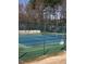 Community tennis courts fenced in with a sign stating it is for residents only at 113 Hawkscrest Ct, Apex, NC 27502