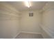 Walk-in closet with ample shelving for organized storage at 113 Hawkscrest Ct, Apex, NC 27502