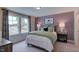 Stylized bedroom with a soccer themed accent wall and a large window at 1133 Sun Springs Rd, Wake Forest, NC 27587