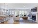 Bright living room featuring hardwood floors, fireplace, and modern decor at 1133 Sun Springs Rd, Wake Forest, NC 27587