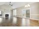 Large living room with a fireplace, hardwood floors, and a sliding glass door to the outside at 124 D'Ango Cir, Angier, NC 27501