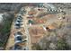 Aerial view of a new home development showcasing houses, streets and landscaping at 1794 Parham Dr, Graham, NC 27253