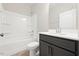 Bathroom featuring vanity with cabinet, tile floor and combination tub and shower at 1794 Parham Dr, Graham, NC 27253