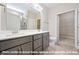 Modern bathroom featuring dual sinks, granite countertops, and ample cabinet space at 1794 Parham Dr, Graham, NC 27253