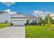 Charming single-story home with a two-car garage and well-manicured lawn at 1794 Parham Dr, Graham, NC 27253
