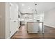 Spacious kitchen with a center island, pendant lights, and ample cabinet space at 1794 Parham Dr, Graham, NC 27253