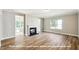 Cozy living room with fireplace, neutral color palette, and natural light at 1794 Parham Dr, Graham, NC 27253