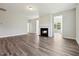 Cozy living room with a fireplace and seamless flooring throughout at 1794 Parham Dr, Graham, NC 27253