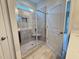 New tiled shower with a glass door, niche, and seating in a modern bathroom at 1794 Parham Dr, Graham, NC 27253