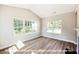 Bright sunroom with large windows overlooking the backyard, perfect for relaxing at 1794 Parham Dr, Graham, NC 27253