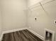 New walk-in closet with wood-look flooring and adjustable shelving at 1794 Parham Dr, Graham, NC 27253