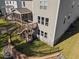 Aerial view of backyard with a screened-in porch and a well-manicured lawn at 204 Woodstaff Ave, Wake Forest, NC 27587