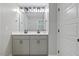 Bathroom featuring double sinks, modern black hardware, and a bright, clean aesthetic at 204 Woodstaff Ave, Wake Forest, NC 27587