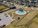 Overhead view of a neighborhood pool and playground, surrounded by homes and green spaces at 204 Woodstaff Ave, Wake Forest, NC 27587