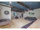 Finished basement with wet bar, stainless steel refrigerator, modern dart board, and recessed lighting at 204 Woodstaff Ave, Wake Forest, NC 27587