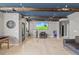 Recreational space with wet bar, stainless steel mini fridge, rustic beams, and stylish decor at 204 Woodstaff Ave, Wake Forest, NC 27587