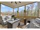 This screened-in porch has comfortable seating and beautiful outdoor views at 204 Woodstaff Ave, Wake Forest, NC 27587