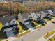 Aerial street view of houses with manicured lawns in a suburban neighborhood at 204 Woodstaff Ave, Wake Forest, NC 27587