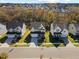 Overhead street view of three homes and autumn trees in a suburban neighborhood at 204 Woodstaff Ave, Wake Forest, NC 27587