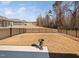 Backyard featuring a concrete patio, decorative urn, and metal fence at 2109 Flycatcher Ln, Fuquay Varina, NC 27526