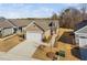 Aerial exterior view of a charming single Gathering home with a two car garage and driveway at 2109 Flycatcher Ln, Fuquay Varina, NC 27526