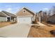 Charming single Gathering home featuring a two-car garage and beautiful curb appeal at 2109 Flycatcher Ln, Fuquay Varina, NC 27526