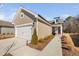 Exterior view of a charming single Gathering home with a two car garage and walkway at 2109 Flycatcher Ln, Fuquay Varina, NC 27526