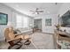 Comfortable living room with neutral tones, ceiling fan and lots of natural light at 2109 Flycatcher Ln, Fuquay Varina, NC 27526