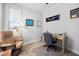 Cozy home office with a comfortable chair, desk, and window letting in natural light at 2109 Flycatcher Ln, Fuquay Varina, NC 27526