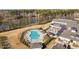 Stunning aerial view of the community pool and clubhouse, perfect for relaxation and recreation at 2109 Flycatcher Ln, Fuquay Varina, NC 27526
