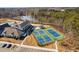 Community tennis courts and clubhouse offer residents opportunities for sports and social activities at 2109 Flycatcher Ln, Fuquay Varina, NC 27526