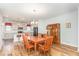 Inviting dining area with hardwood floors adjacent to modern kitchen at 234 Palmetto Tree Way, Knightdale, NC 27545