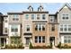 Charming townhome showcasing a brick facade and well-manicured landscaping at 234 Palmetto Tree Way, Knightdale, NC 27545