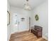 Bright entryway featuring hardwood floors and charming decorative details at 234 Palmetto Tree Way, Knightdale, NC 27545