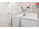 Laundry room with washer and dryer and wire rack at 234 Palmetto Tree Way, Knightdale, NC 27545