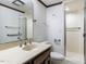 Bright bathroom featuring a walk-in shower and a spacious vanity with dual sinks at 241 Beachers Brook Ln, Cary, NC 27511