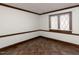 Bedroom with decorative window and dark-colored tile flooring at 241 Beachers Brook Ln, Cary, NC 27511