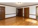 Spacious bedroom featuring hardwood floors, closet space, and an ensuite bathroom at 241 Beachers Brook Ln, Cary, NC 27511