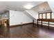 Bonus room with hardwood floors, storage shelves, and a geometric ceiling at 241 Beachers Brook Ln, Cary, NC 27511