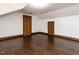 Bonus room featuring hardwood floors and white walls with wood trim at 241 Beachers Brook Ln, Cary, NC 27511