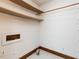 Empty walk in closet with white walls, tiled floor, and storage shelves at 241 Beachers Brook Ln, Cary, NC 27511