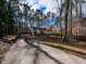 Charming home with a long driveway surrounded by towering trees at 241 Beachers Brook Ln, Cary, NC 27511