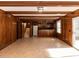 Inviting living room with tile flooring, wood-paneled walls, and a convenient kitchenette at 241 Beachers Brook Ln, Cary, NC 27511