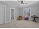 Bedroom featuring an ensuite bathroom, ceiling fan and lovely wooded view at 290 Whistlers Cv, Louisburg, NC 27549